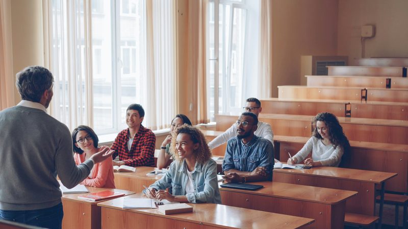 Instructor teaching students in a university classroom