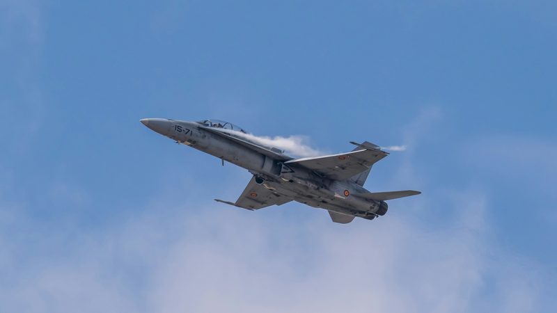 Military aircraft in flight representing defense and mission support